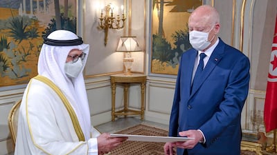 Dr Anwar Gargash delivers a letter from UAE President Sheikh Khalifa to Tunisian President Kais Saied at Carthage Palace in Tunis on Saturday. Wam