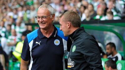 Leicester City manager Claudio Ranieri (L) talks with Celtic manager Brendan Rodgers ahead of the International Champions Cup football match between Scottish Premiership champions Celtic and English Premier League champions Leicester City at Celtic Park in Glasgow, Scotland on July 23, 2016. Andy Buchanan / AFP