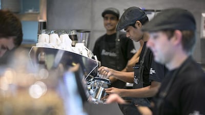 Baristas work at The Coffee Club in the Yas Mall, Abu Dhabi. Silvia Razgova / The National