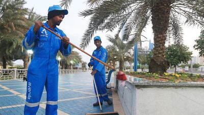 Workers cleaning up along the Corniche spent hours collecting empty foam cans, paper cups and other debris. Ravindranath K / The National