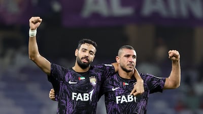 Ramy Rabia, right, celebrates scoring for Al Ain