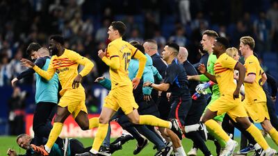 Barcelona players and staff head for the tunnel at ERCDE Stadium after being chased by Espanyol fans. Getty Images