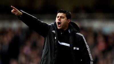Southampton manager Mauricio Pochettino shouts instructions during the Premier League match against West Ham at the Boleyn Ground on February 22, 2014. Ben Hoskins / Getty Images