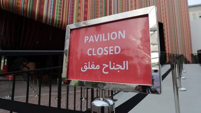 'Pavilion closed' sign at the entrance of the Peru pavilion because of rain damage.
