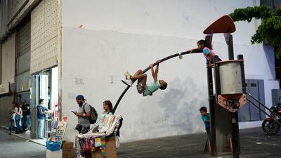 Children play in a small jungle gym on Sabana Grande boulevard in Caracas, Venezuela. AP Photo