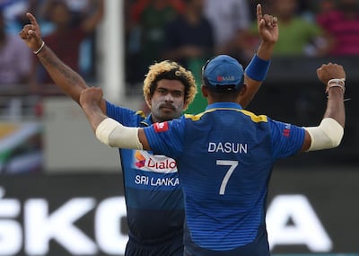 Sri Lankan bowler Lasith Malinga, left, celebrates the dismissal of Bangladesh batsman Mohammad Mithun. AFP