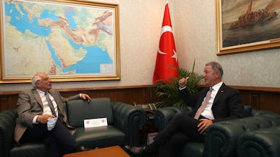Josep Borrell, High Representative and Vice-President of the European Commission, left, and Turkey’s Defence Minister Hulusi Akar speak during a meeting in Ankara, Turkey, on Monday, July 6. Turkish Defence Ministry via AP