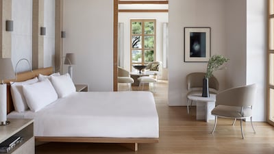 A bedroom in one of the Amanzoe villas