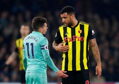 Watford's Troy Deeney talks to Arsenal's Lucas Torreira after being sent off. Reuters