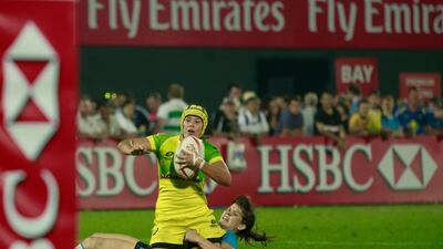 Australia, in yellow, defeated Russia to win the women’s final on Day 2 at the Dubai Rugby Sevens. Victor Besa for The National