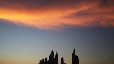 UAE Central Bank data showed that its assets held outside the country fell by 13 per cent to Dh296.9bn in January from Dh341.1bn in December as the government sought to fill shortfalls. Pictured, Dubai Marina. Jon Gambrell / AP Photo