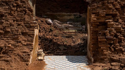 A Buddha statue damaged by an earthquake at a temple in Mandalay, Myanmar. AFP