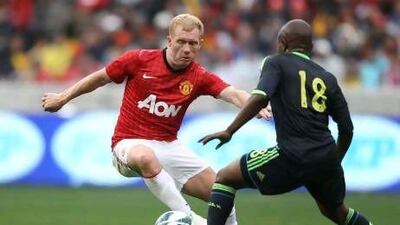 Paul Scholes, in action during Manchester United's pre-season tour of South Africa last week, has been with the club since he was 14. Luke Walker / Getty Images