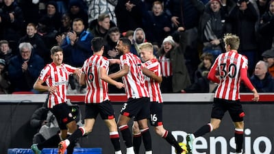 Brentford players celebrate after Liverpool's Ibrahima Konate scored an own goal to make it 1-0. Reuters