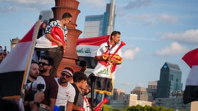 Iraqi fans chant on the Rocky steps in Philadelphia. Joshua Longmore / The National