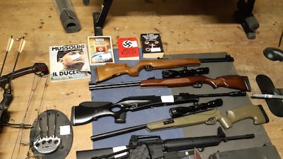 A handout photo made available by the Italian State Police (Polizia di Stato) shows part of the items seized from a neo-Nazi group during a nation-wide police operation, in Enna, southern EPA