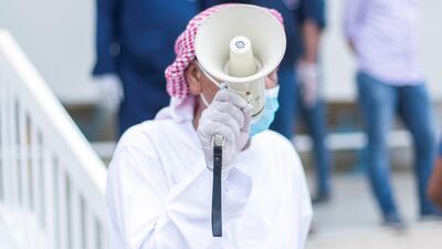 An auction at the Ajman fish market on April 12, 2020. Reem Mohammed / The National