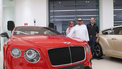 Dream machines. Visitors look at the new models of Bentley cars at the Al Habtoor Motors and Bentley Emirates flagship showroom in Dubai. Ravindranath K / The National