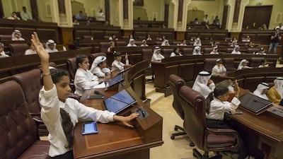 The 15th edition of the Sharjah Children Shura Council gets underway on April 26, 2017, at the Consultative Council of Sharjah building, with 11-year-old Alia Saif Hasan Al Marzouqi (front) raising her hand with a question. Antonie Robertson / The National