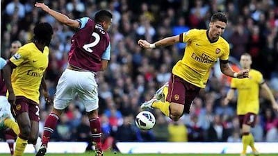 Olivier Giroud finally scored his first Premier League goal, against West Ham, as the Gunners won 3-1 at Upton Park. Glyn Kirk / AFP
