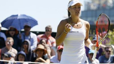 Angelique Kerber of Germany celebrates a point against Carina Witthoeft of Germany during the singles first round match at the All England Lawn Tennis Championships in Wimbledon, London, Tuesday June 30, 2015. (AP Photo/Kirsty Wigglesworth)