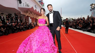 Rosa Perrotta, in a pink Rami Kadi gown, and Pietro Tartaglione, in a classic tuxedo. Getty Images