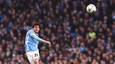 Manchester City’s Spanish midfielder David Silva passes the ball during the Uefa Champions league quarter-final second leg football match between Manchester City and Paris Saint-Germain at the Etihad stadium in Manchester on April 12, 2016. AFP / PAUL ELLIS
