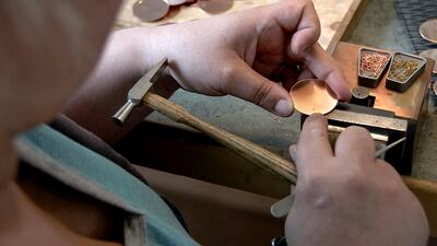 A watchmaker works on the dial of a timepiece. The brand has less than 20 people working on these luxury watches. Courtesy Atelier Laurent Ferrier