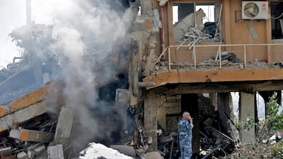 A Syrian soldier inspects the wreckage of a building described as part of the Scientific Studies and Research Centre (SSRC) compound in the Barzeh district, north of Damascus, during a press tour organised by the Syrian information ministry, on April 14, 2018. The United States, Britain and France launched strikes against Syrian President Bashar al-Assad's regime early on April 14 in response to an alleged chemical weapons attack after mulling military action for nearly a week. Syrian state news agency SANA reported several missiles hit a research centre in Barzeh, north of Damascus, "destroying a building that included scientific labs and a training centre". AFP PHOTO / LOUAI BESHARA