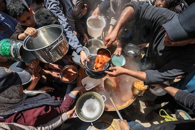 Palestinians in Gaza rely on humanitarian agencies for food after nearly all farmland in the territory was destroyed during two years of war. AFP