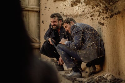 Karim Abdel Aziz and Ahmed Ezz take cover during an action scene in 7 Dogs. Photo: Sela