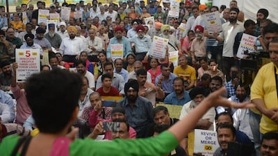Customers and depositors of the Punjab and Maharashtra Co-operative (PMC) Bank attend a protest demanding to get their money back after an alleged 43.55 billion rupees (614 million USD) scam, in Mumbai on October 30, 2019. / AFP / Punit PARANJPE