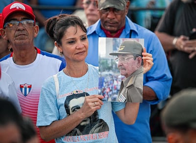 A woman holds a photograph of former Cuban president Raul Castro, who has been indicted by a US court, during a rally outside the US Embassy in Havana last month. AFP