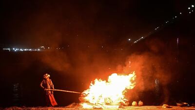 A worker cremates unclaimed bodies of people thought to have died from Covid-19 at a mass crematorium in the north Indian city of Allahabad. India recorded the highest yet daily coronavirus mortalities - 3,980 - on Thursday. Getty Images