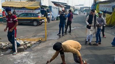 Ghaziabad farmers light firecrackers in celebration of the laws being repealed. AFP