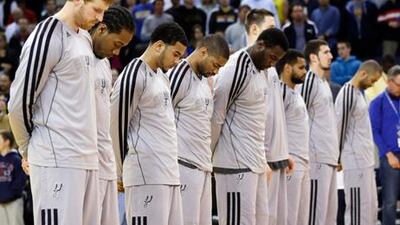 Members of the San Antonio Spurs' squad observe a moment's silence for victims of the Boston Marathon explosions.