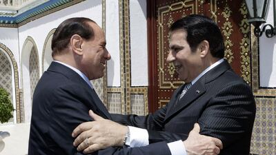 Former Tunisian president Zine El Abidine Ben Ali greets Mr Berlusconi on his arrival in August 2009 at the presidential palace in Tunis. AFP