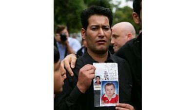 “They came so close, but they never made it,” said Madian el Ibrahimy, as he holds a photograph of his missing son while attending the funeral of his daughter in February.