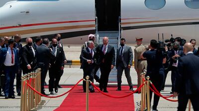 Iraqi President Barham Salih welcomes Jordan's King Abdullah II upon his arrival at Baghdad Airport. AP