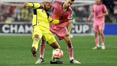 Inter Miami's Sergio Busquets challenges Teal Bunbury of Nashville. Getty Images
