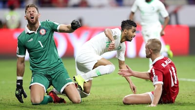 Saudi Arabia's Hussain Al Moqahwi, right, celebrates after scoring against Lebanon at Al Maktoum Stadium in Dubai. Reuters