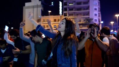 Protesters shout slogans as they block the main highway during ongoing anti-government protests near downtown in Beirut, Lebanon. EPA