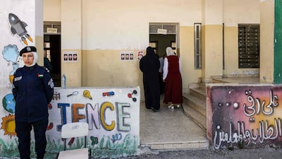 An officer of the Palestinian security forces on duty at a polling station in the village of Beit Furik, south-east of the occupied West Bank city of Nablus. AFP