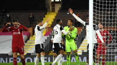 Tosin Adarabioyo congratulates Alphonse Areola of Fulham after he makes a save. Getty