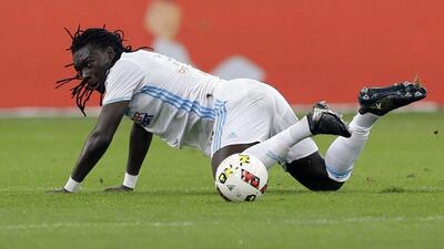 Marseille's Bafetimbi Gomis falls down during the French Ligue 1 match against Metz at the Velodrome Stadium, in Marseille, southern France, Sunday, October 16, 2016. Claude Paris / AP Photo