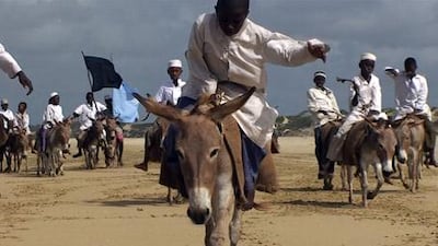A still from Wael Shawky's 13-minute video Telematch Crusades, from 2009, which was shot on a beach in Kenya. His Telematch series borrows the basic structure of an old West German TV show to explore contentious moments of cultural exchange.