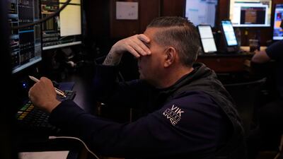 Trading on the floor of the New York Stock Exchange. The tech-heavy Nasdaq Composite fell by 2.4 per cent on Friday, bringing its losses to about 10 per cent since its record close on July 10, confirming it was in correction territory. AP