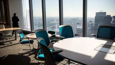 Members of the media explore a model office, used to exhibit what a business space could look like on the 63rd floor of One World Trade Center. Andrew Burton /Getty Images / AFP