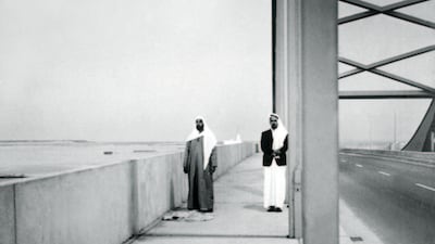 In 1968, Sheikh Zayed bin Sultan Al Nahyan, the Founding Father of the UAE, prepares to pray on Al Maqta Bridge, accompanied by one of his most trusted advisers, Ahmed Al Suwaidi. Photo: National Archives