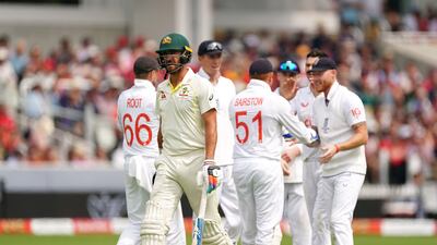 Australia bowler Mitchell Starc leaves the field after being dismissed by England's James Anderson for six. PA